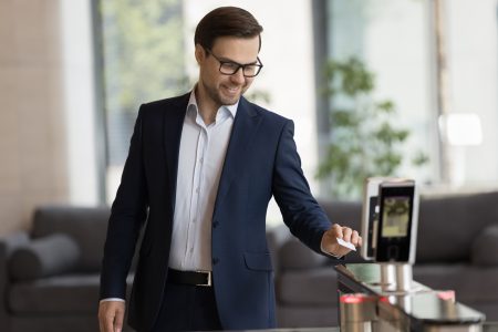 Smiling,Handsome,Businessman,In,Suit,Swipe,Pass,Card,To,Electronic